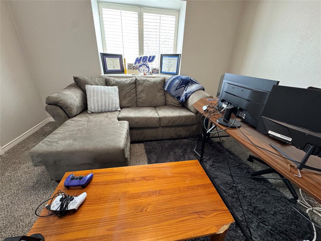 3448 Lark Meadow Way Dallas, TX 75287 - Photo 35 of 39 a living room with furniture rug and a window