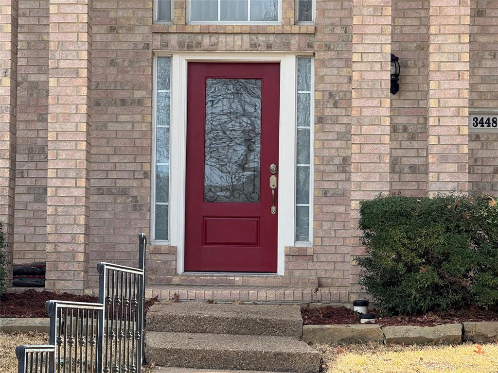 3448 Lark Meadow Way Dallas, TX 75287 - Photo 4 of 39 a front view of a house with a yard