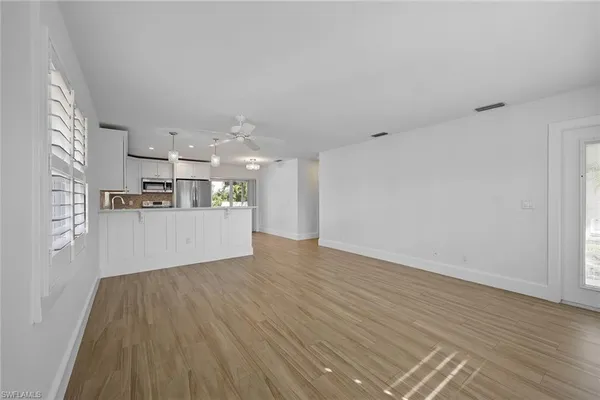 a view of kitchen and wooden floor