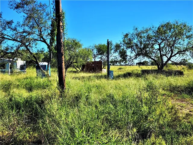 a swimming pool with an outdoor space and seating area