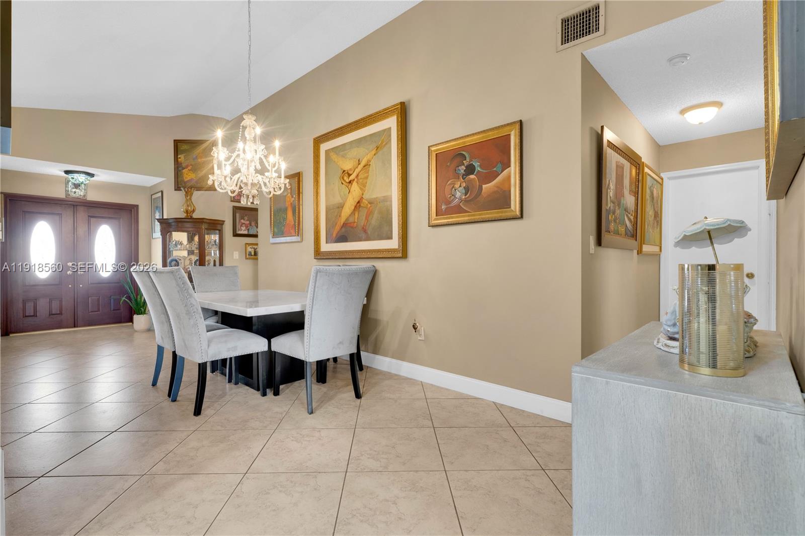 11365 Southwest 143rd Court Miami, FL 33186 - Photo 11 of 40 a dining room with furniture and chandelier or bathroom