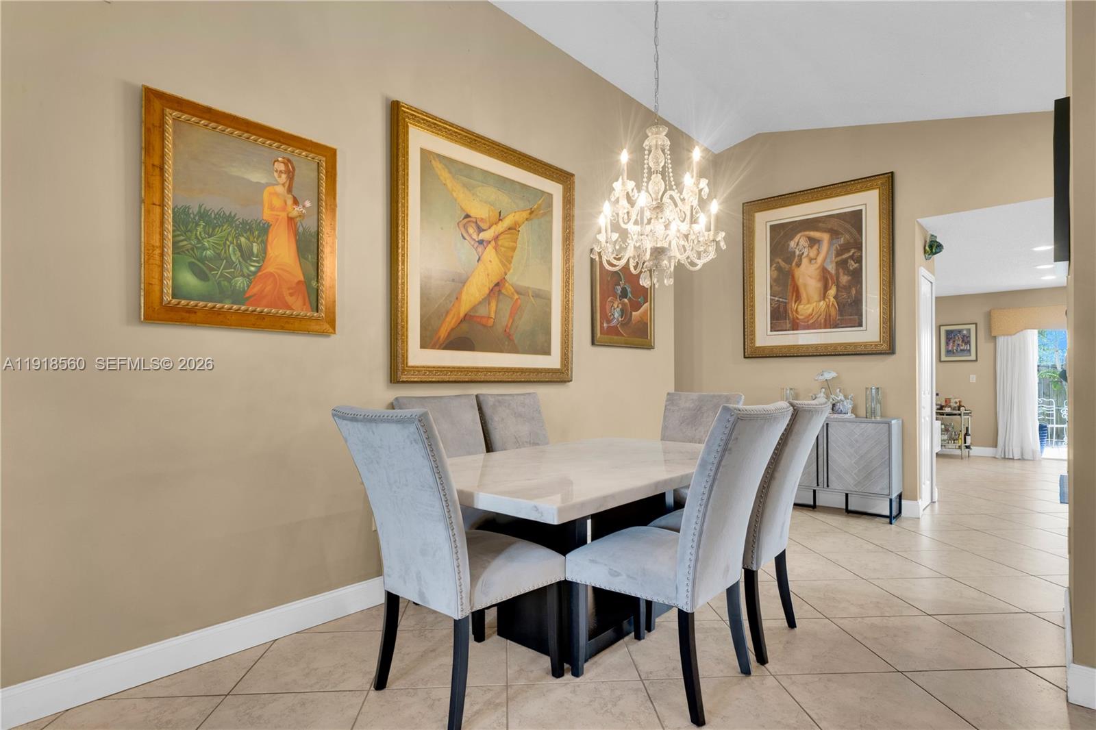 11365 Southwest 143rd Court Miami, FL 33186 - Photo 13 of 40 a view of a dining room with furniture and chandelier