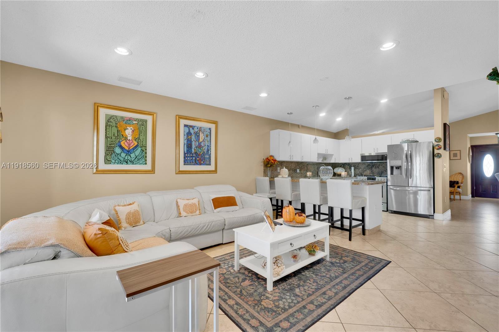 11365 Southwest 143rd Court Miami, FL 33186 - Photo 19 of 40 a living room with furniture and kitchen view