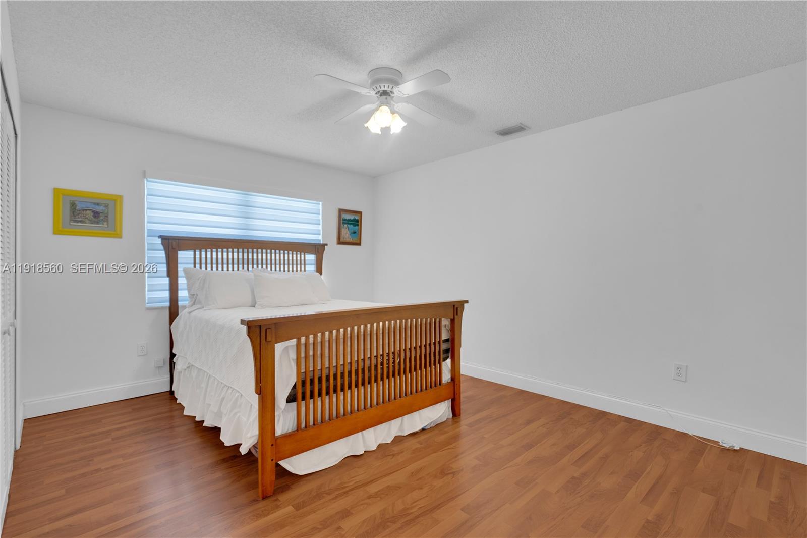 11365 Southwest 143rd Court Miami, FL 33186 - Photo 22 of 40 a view of a room with wooden floor