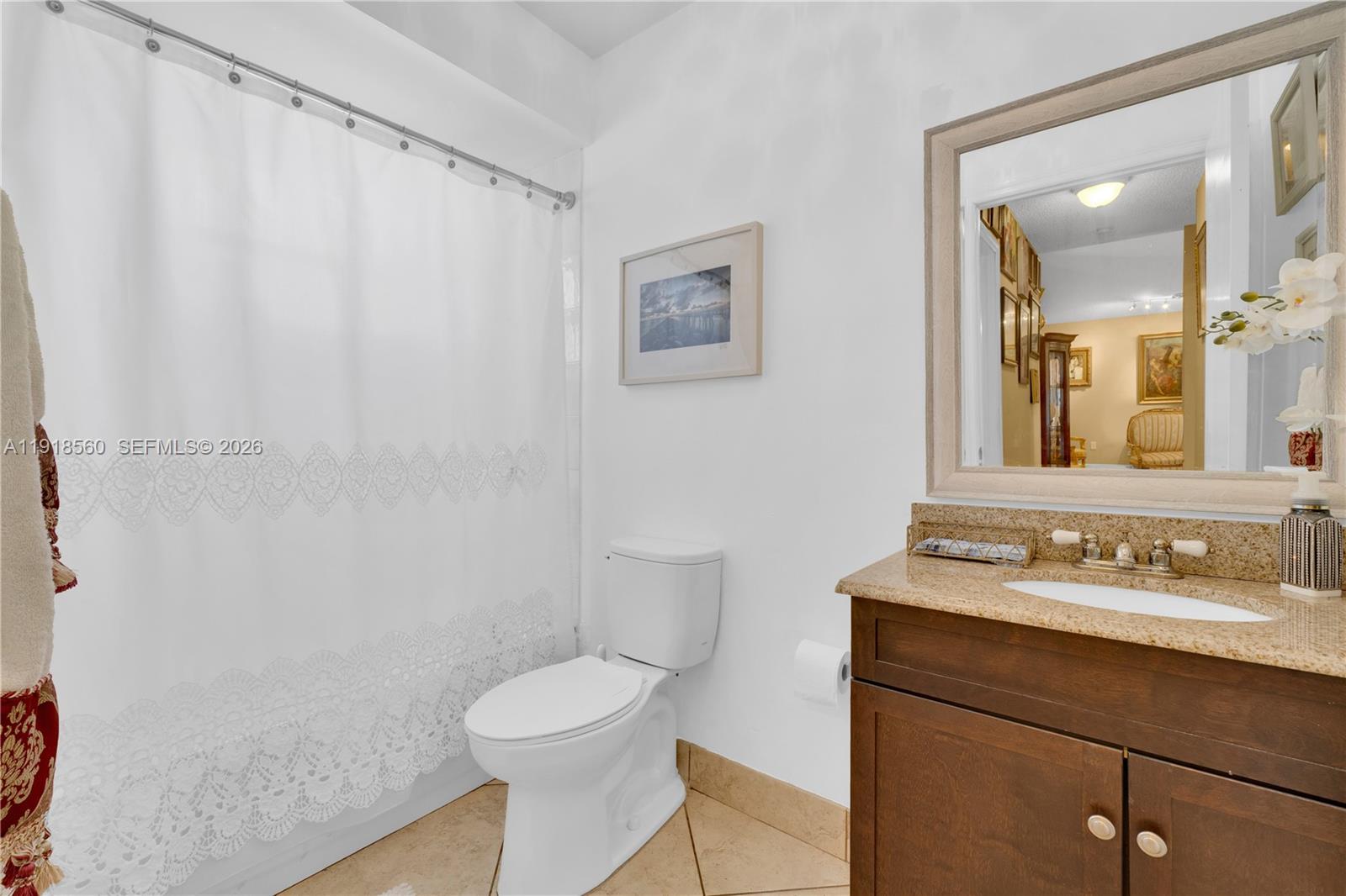 11365 Southwest 143rd Court Miami, FL 33186 - Photo 25 of 40 a bathroom with a sink mirror vanity and toilet
