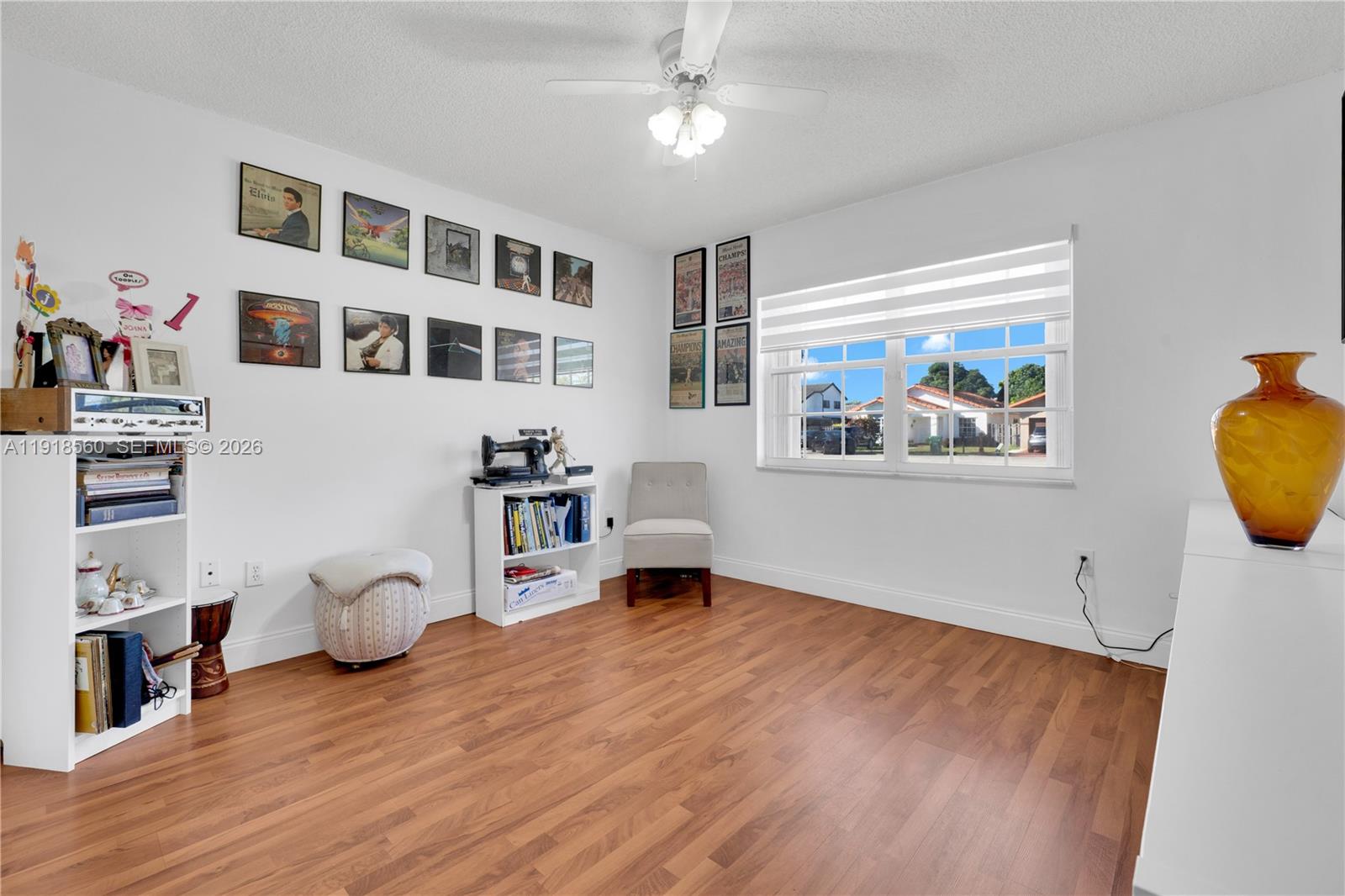 11365 Southwest 143rd Court Miami, FL 33186 - Photo 26 of 40 a living room with furniture and a wooden floor