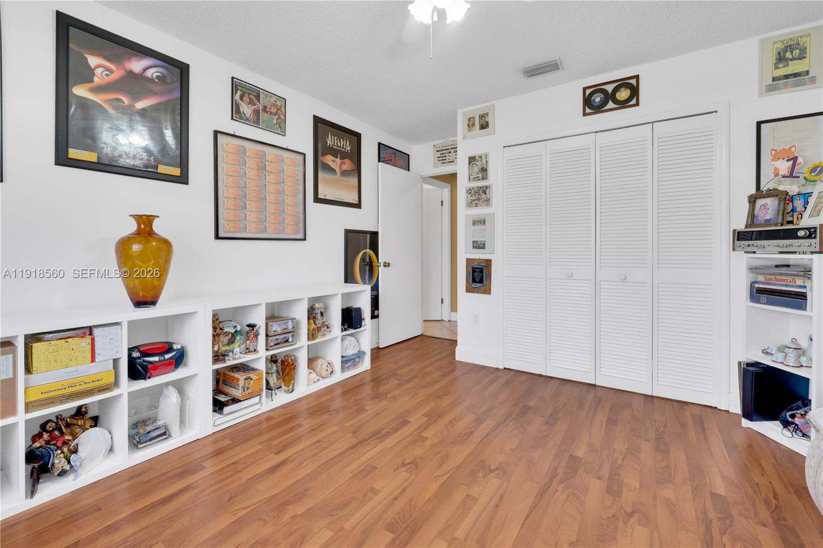 11365 Southwest 143rd Court Miami, FL 33186 - Photo 27 of 40 a view of a livingroom with furniture and cabinet
