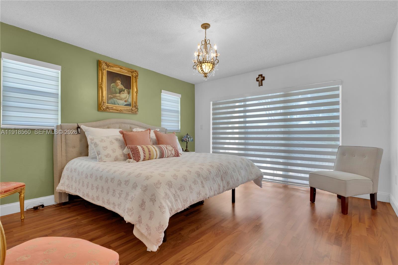 11365 Southwest 143rd Court Miami, FL 33186 - Photo 28 of 40 a bed room with a bed and a chair