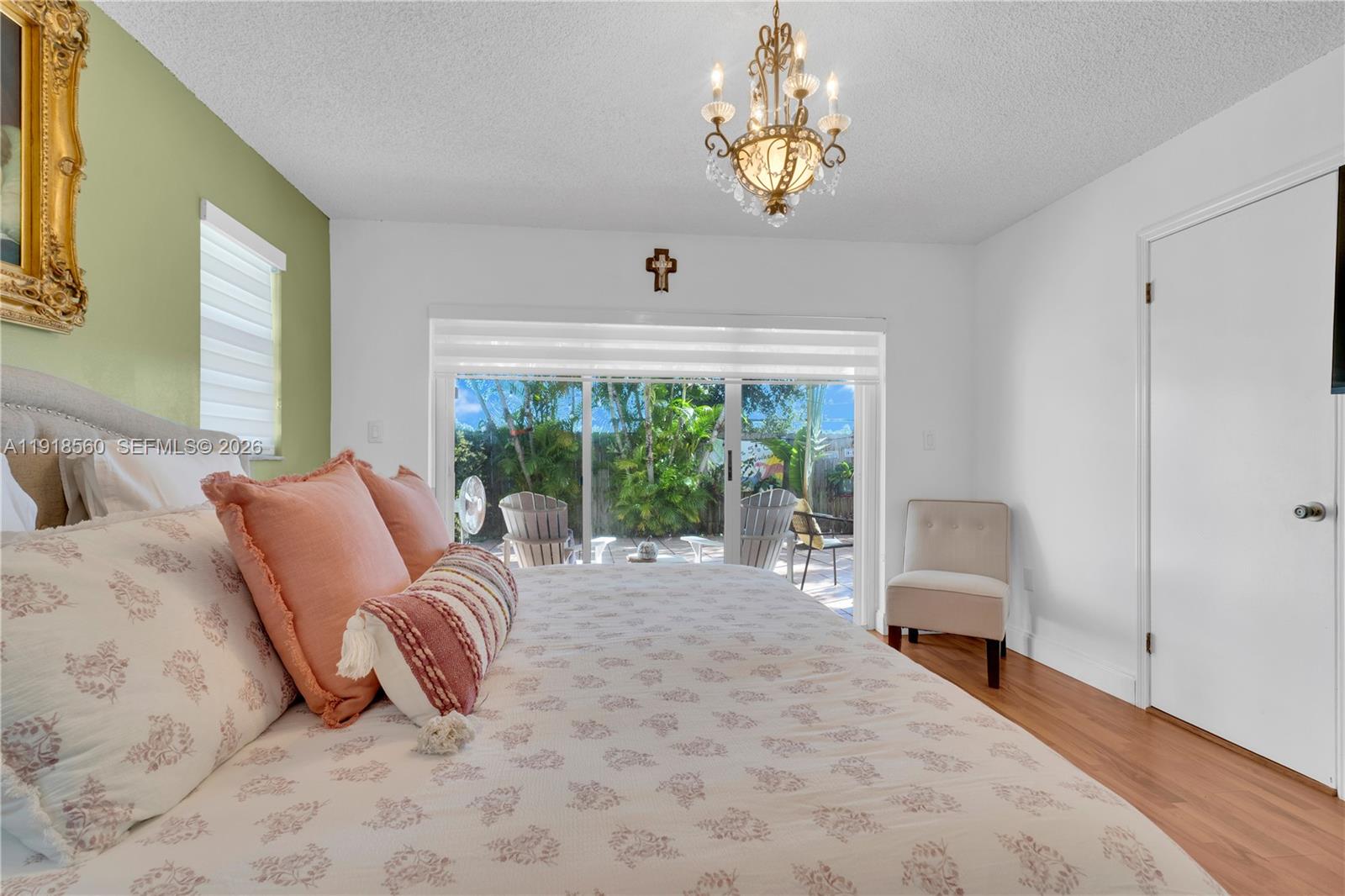 11365 Southwest 143rd Court Miami, FL 33186 - Photo 30 of 40 a living room with furniture chandelier and a large window
