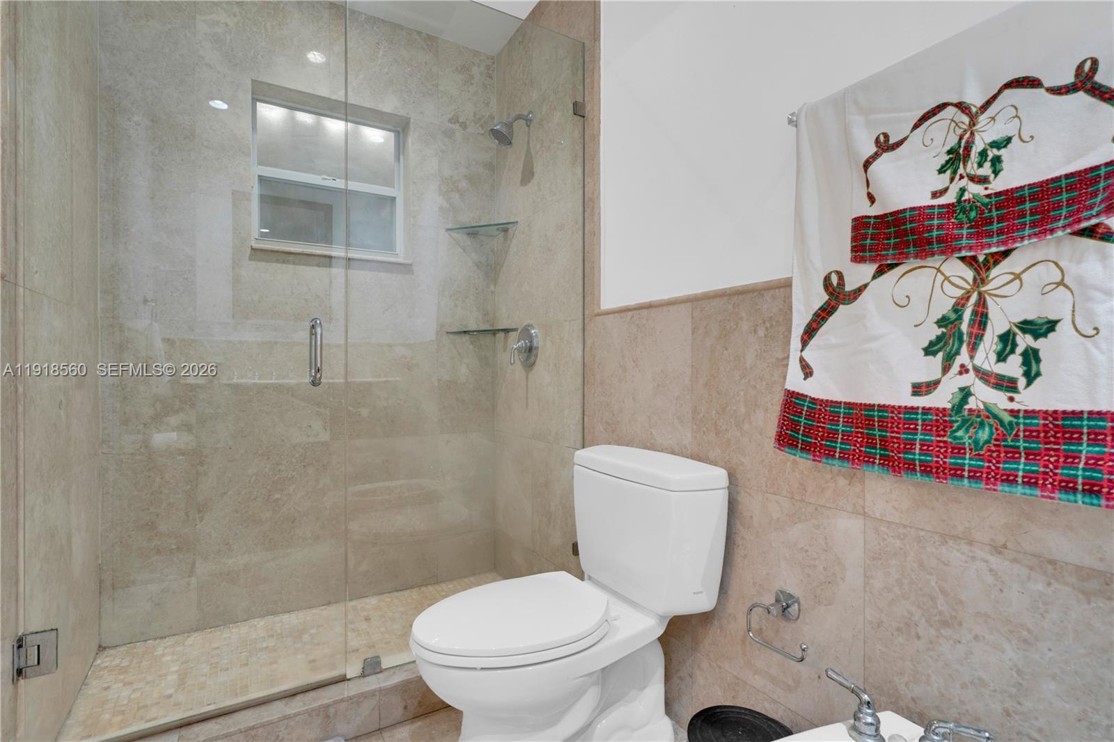 11365 Southwest 143rd Court Miami, FL 33186 - Photo 33 of 40 a bathroom with a toilet and a shower