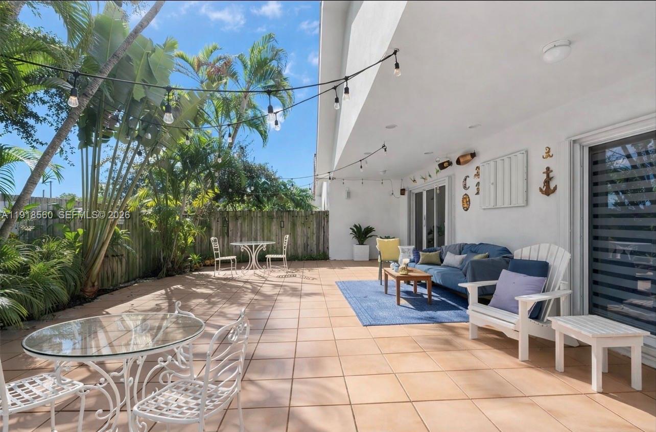 11365 Southwest 143rd Court Miami, FL 33186 - Photo 38 of 40 a backyard of a house with outdoor seating