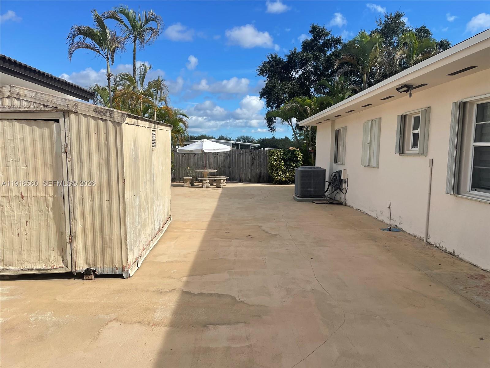 11365 Southwest 143rd Court Miami, FL 33186 - Photo 40 of 40 a view of a house with a backyard