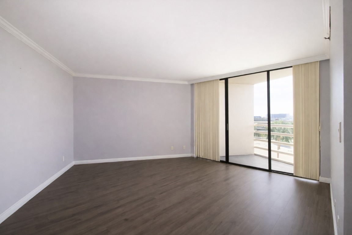 3525 Sage Road, Unit 718 Houston, TX 77056 - Photo 27 of 38 an empty room with wooden floor and sliding door