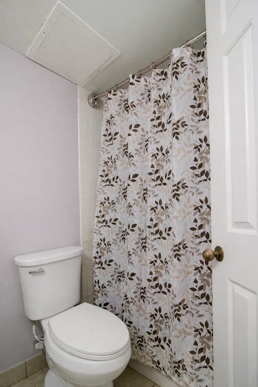 3525 Sage Road, Unit 718 Houston, TX 77056 - Photo 38 of 38 a white toilet sitting next to a shower curtain