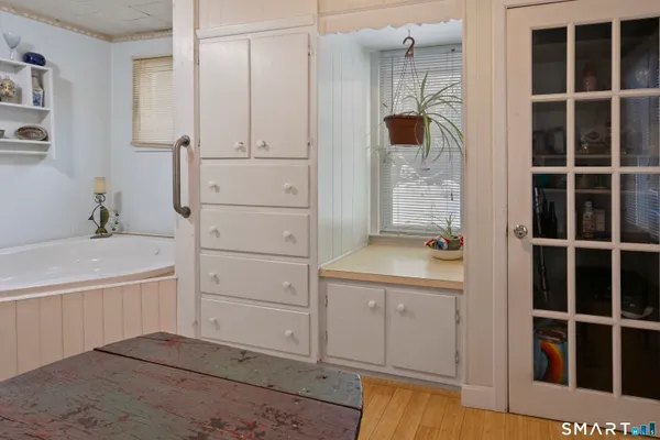 a bathroom with a tub and a sink