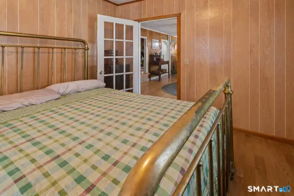 a bedroom with a bed and a dresser