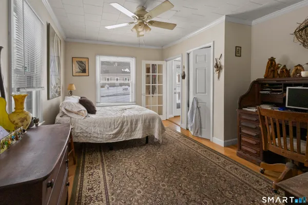 a bedroom with furniture and a window