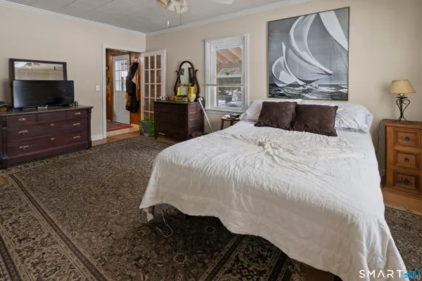 a bedroom with a bed and a television in it