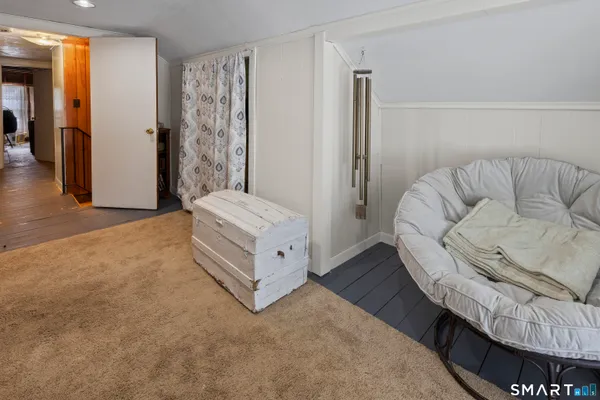 a spacious bedroom with a bed and a couch