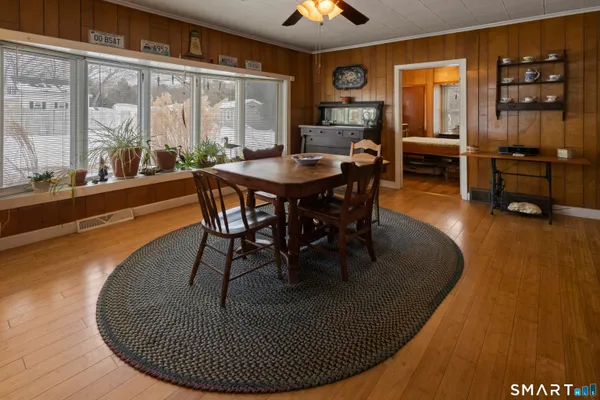 a dining room with furniture window and outside view