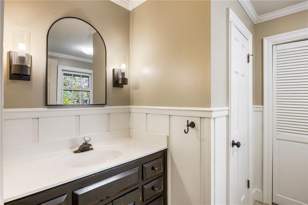 1505 Old John Ward Road Marietta, GA 30064 - Photo 16 of 50 a bathroom with a sink a toilet and mirror