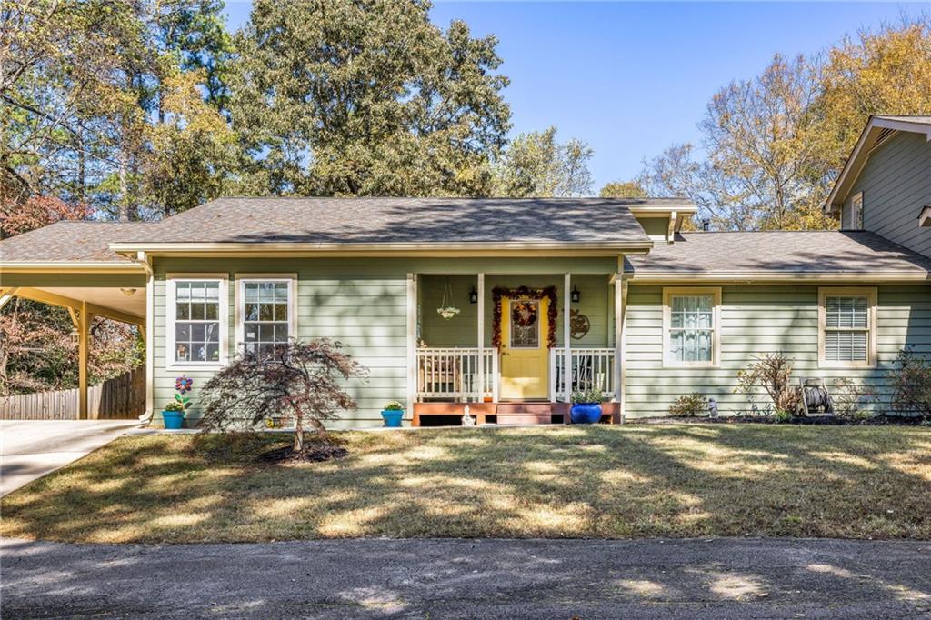 1505 Old John Ward Road Marietta, GA 30064 - Photo 30 of 50 a front view of a house with a yard