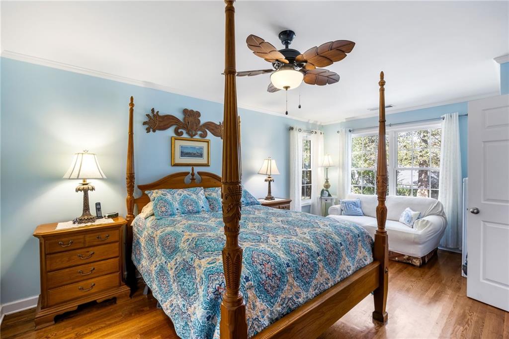 1505 Old John Ward Road Marietta, GA 30064 - Photo 38 of 50 a bedroom with a bed and wooden floor