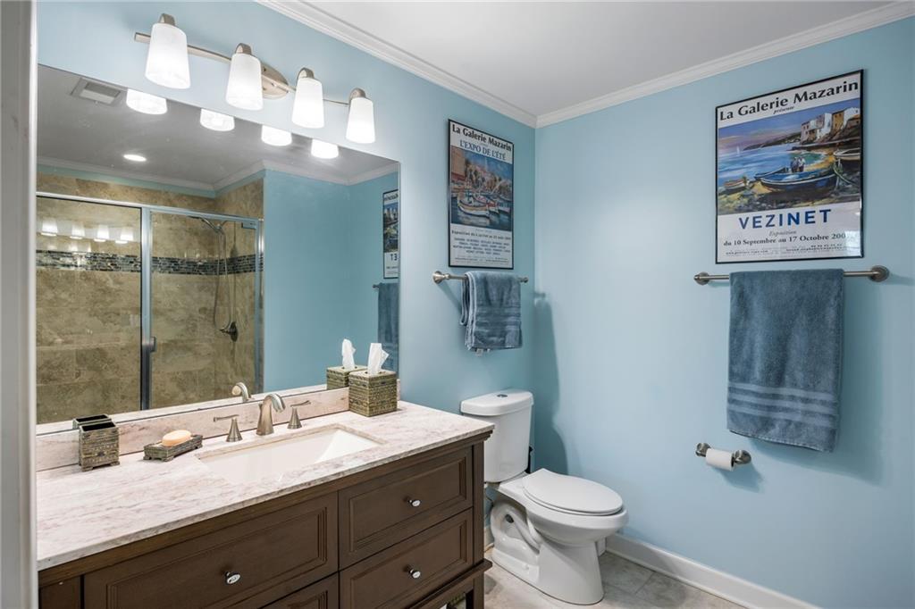 1505 Old John Ward Road Marietta, GA 30064 - Photo 39 of 50 a bathroom with a toilet sink and mirror