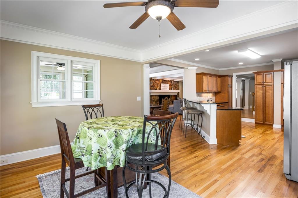 1505 Old John Ward Road Marietta, GA 30064 - Photo 10 of 50 a dining room with furniture a window and wooden floor
