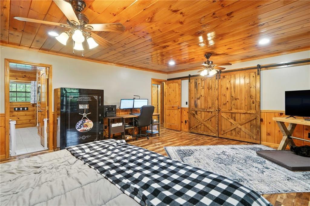 749 Old Federal Road South Chatsworth, GA 30705 - Photo 13 of 45 a bedroom with a bed and a flat tv screen on dresser