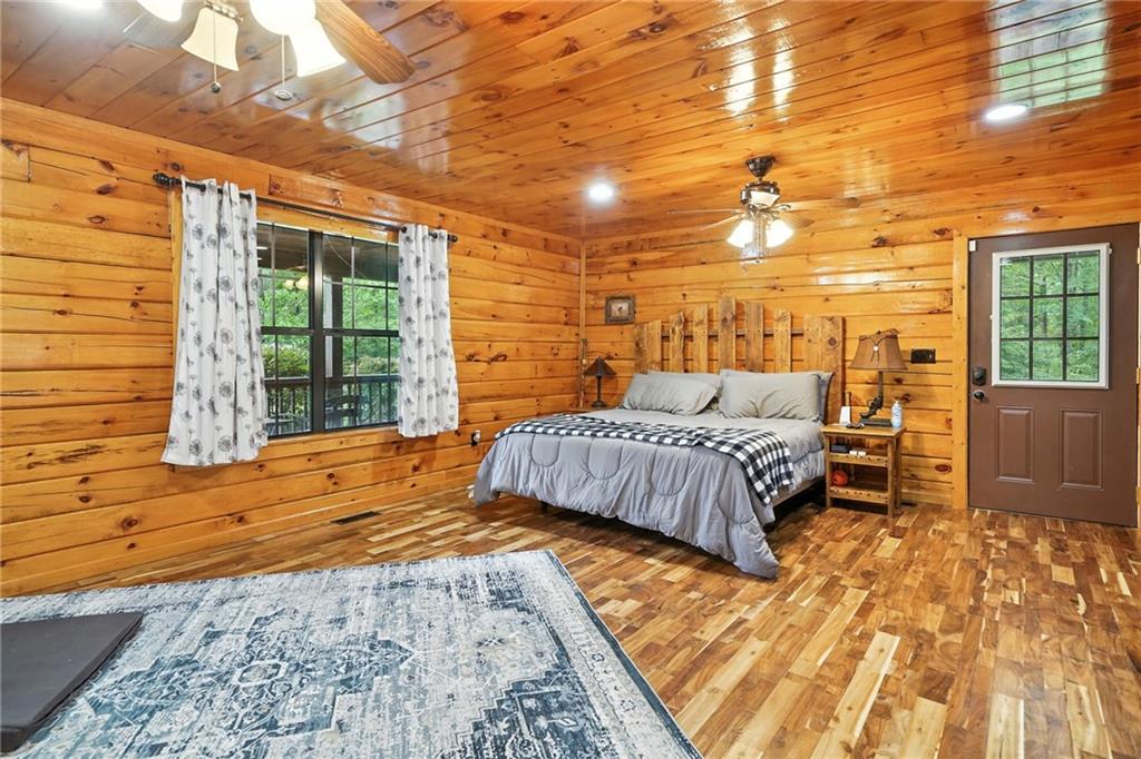 749 Old Federal Road South Chatsworth, GA 30705 - Photo 14 of 45 a bedroom with a bed and wooden floor
