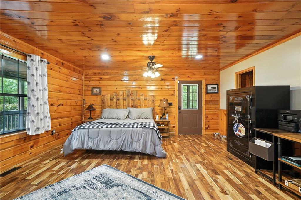 749 Old Federal Road South Chatsworth, GA 30705 - Photo 15 of 45 a bedroom with a bed and wooden floor
