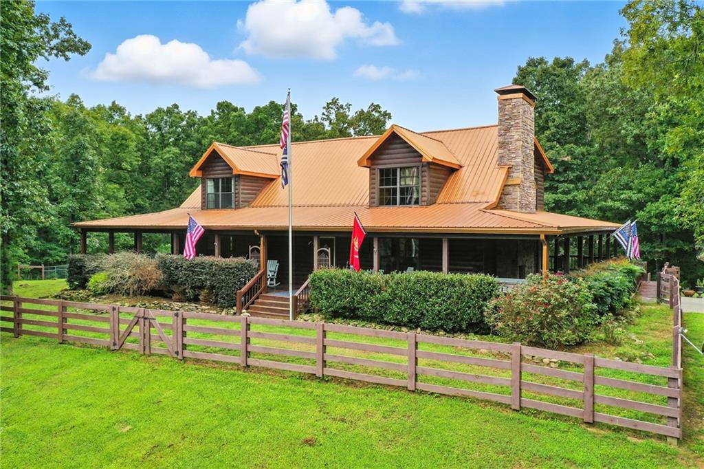 749 Old Federal Road South Chatsworth, GA 30705 - Photo 2 of 45 a front view of a house with a yard