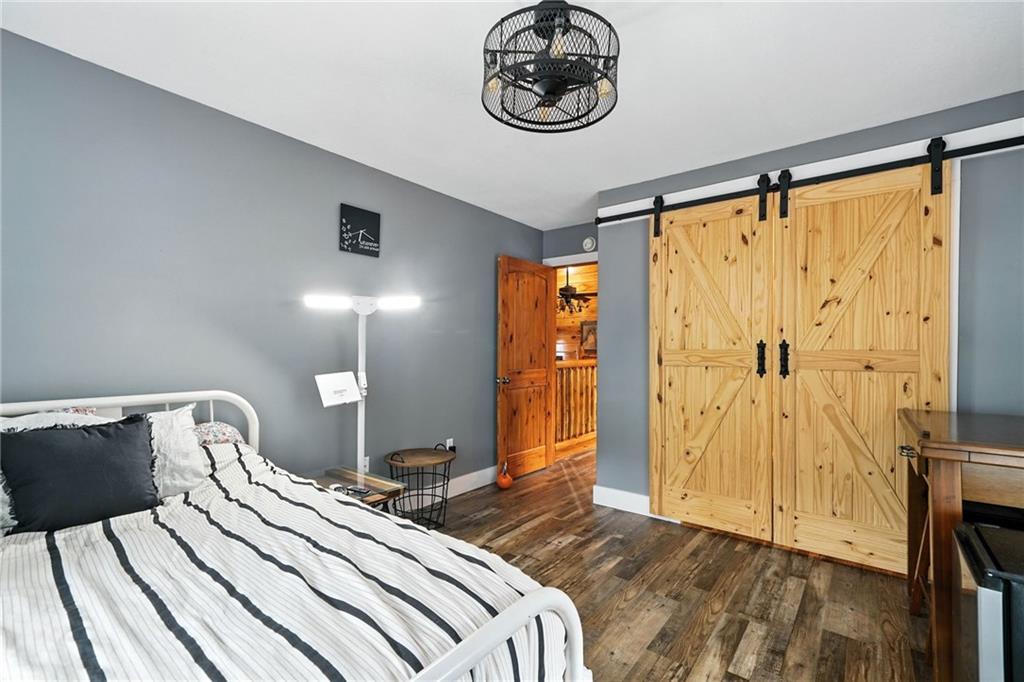 749 Old Federal Road South Chatsworth, GA 30705 - Photo 22 of 45 a bedroom with a bed and a table