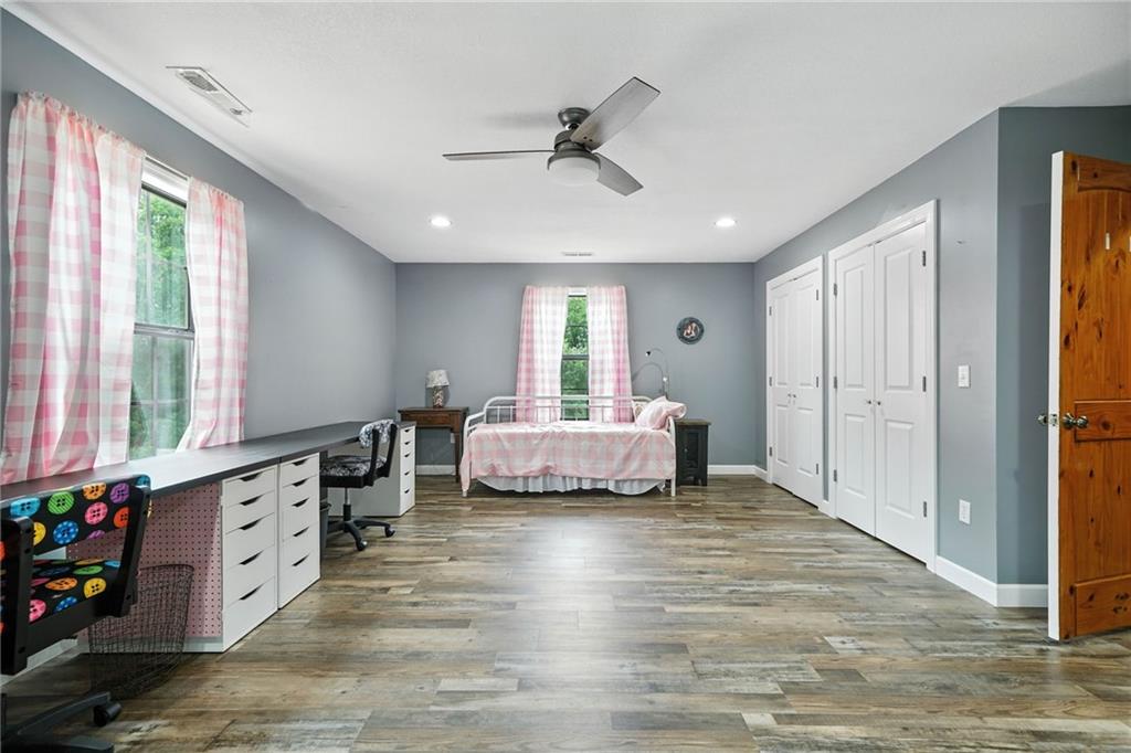 749 Old Federal Road South Chatsworth, GA 30705 - Photo 24 of 45 a spacious bedroom with a bed and a window