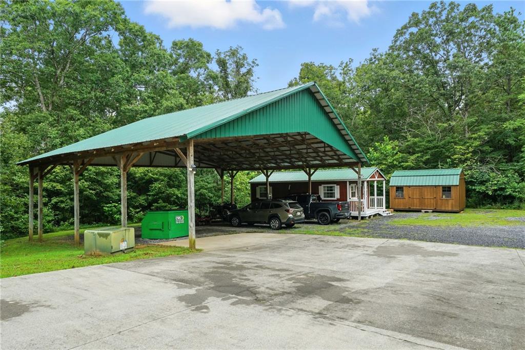 749 Old Federal Road South Chatsworth, GA 30705 - Photo 33 of 45 a porch with a table and chairs under an umbrella