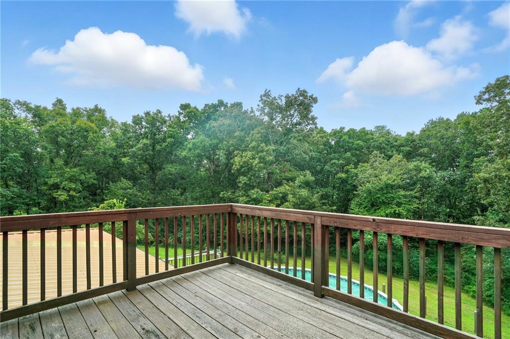 749 Old Federal Road South Chatsworth, GA 30705 - Photo 34 of 45 a balcony with wooden floor and fence