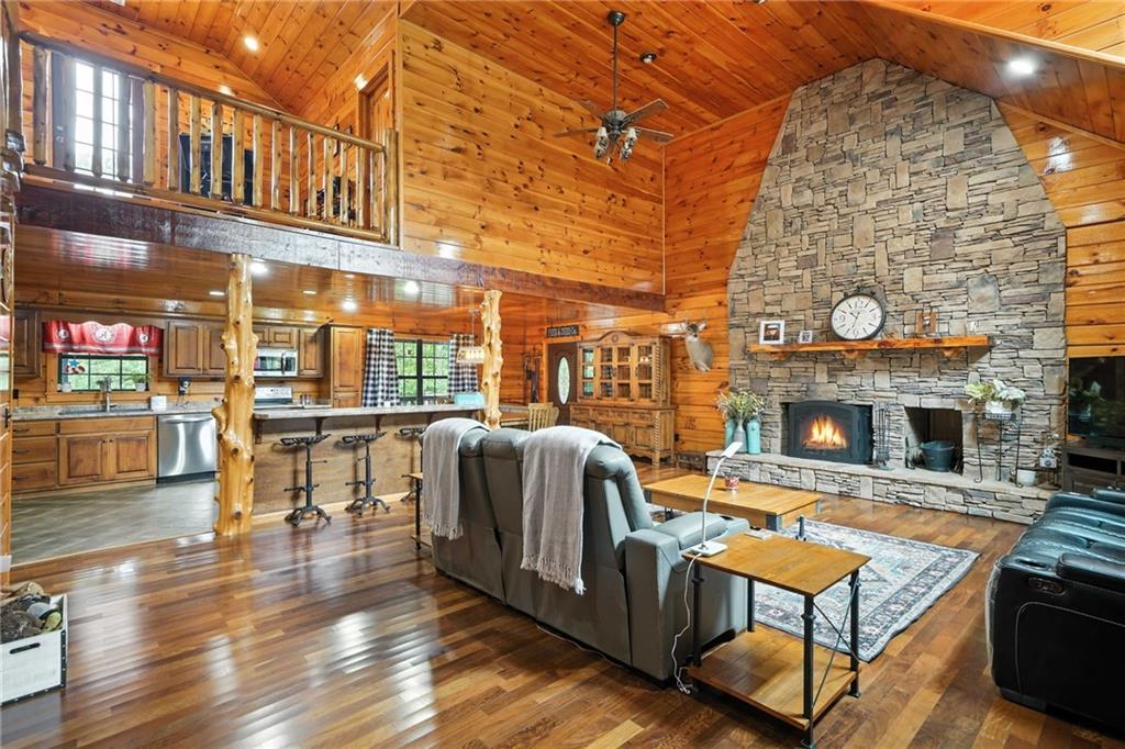 749 Old Federal Road South Chatsworth, GA 30705 - Photo 6 of 45 a living room with fireplace furniture and a wooden floor