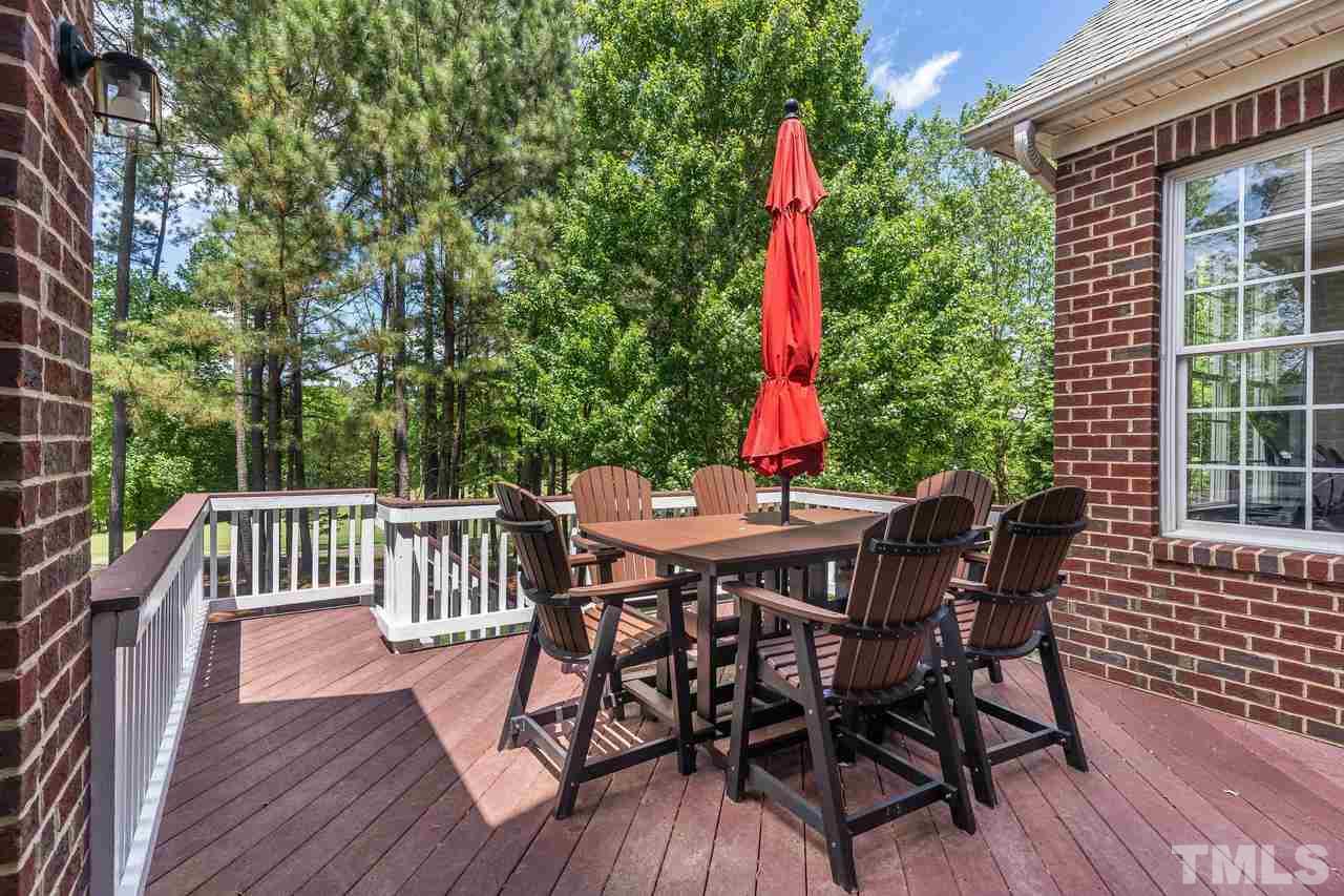 9629 Heathermill Lane Raleigh, NC 27617 - Photo 22 of 28 Rear deck accessed from Sun Room and ground level.