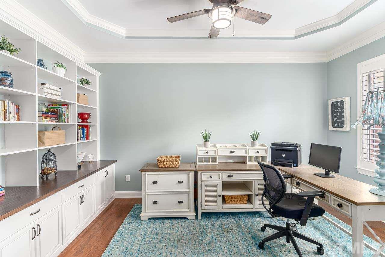 Built in Book shelves, Frosted glass pocket doors for workspace privacy.
