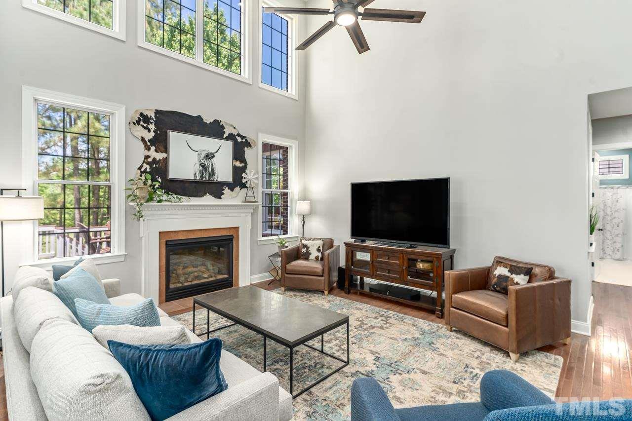 9629 Heathermill Lane Raleigh, NC 27617 - Photo 8 of 28 High ceiling, Gas log fireplace and plenty of natural light.