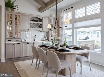 a dining room with furniture and window