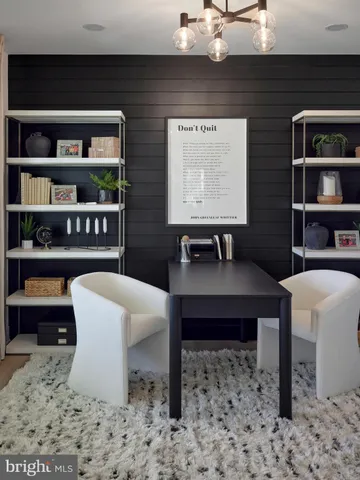 a view of a workspace with furniture