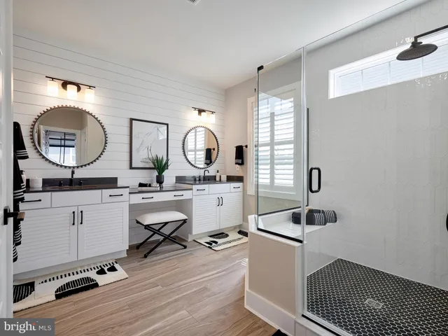 a room with a window a sink and a mirror