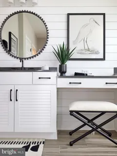 a picture of a bathroom with a sink and mirror