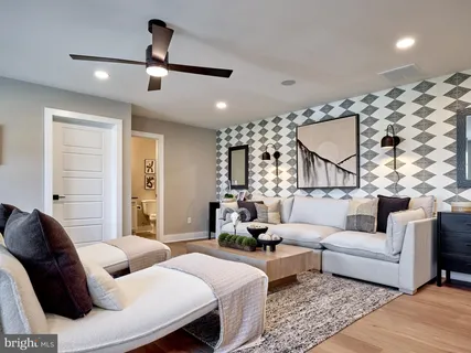 a bedroom with a bed and ceiling fan