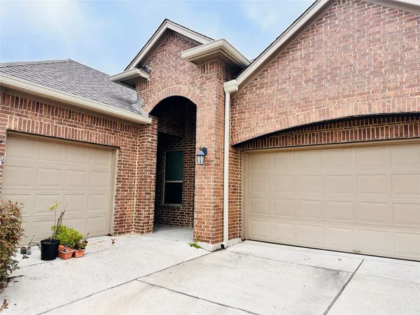 a front view of a house with garage