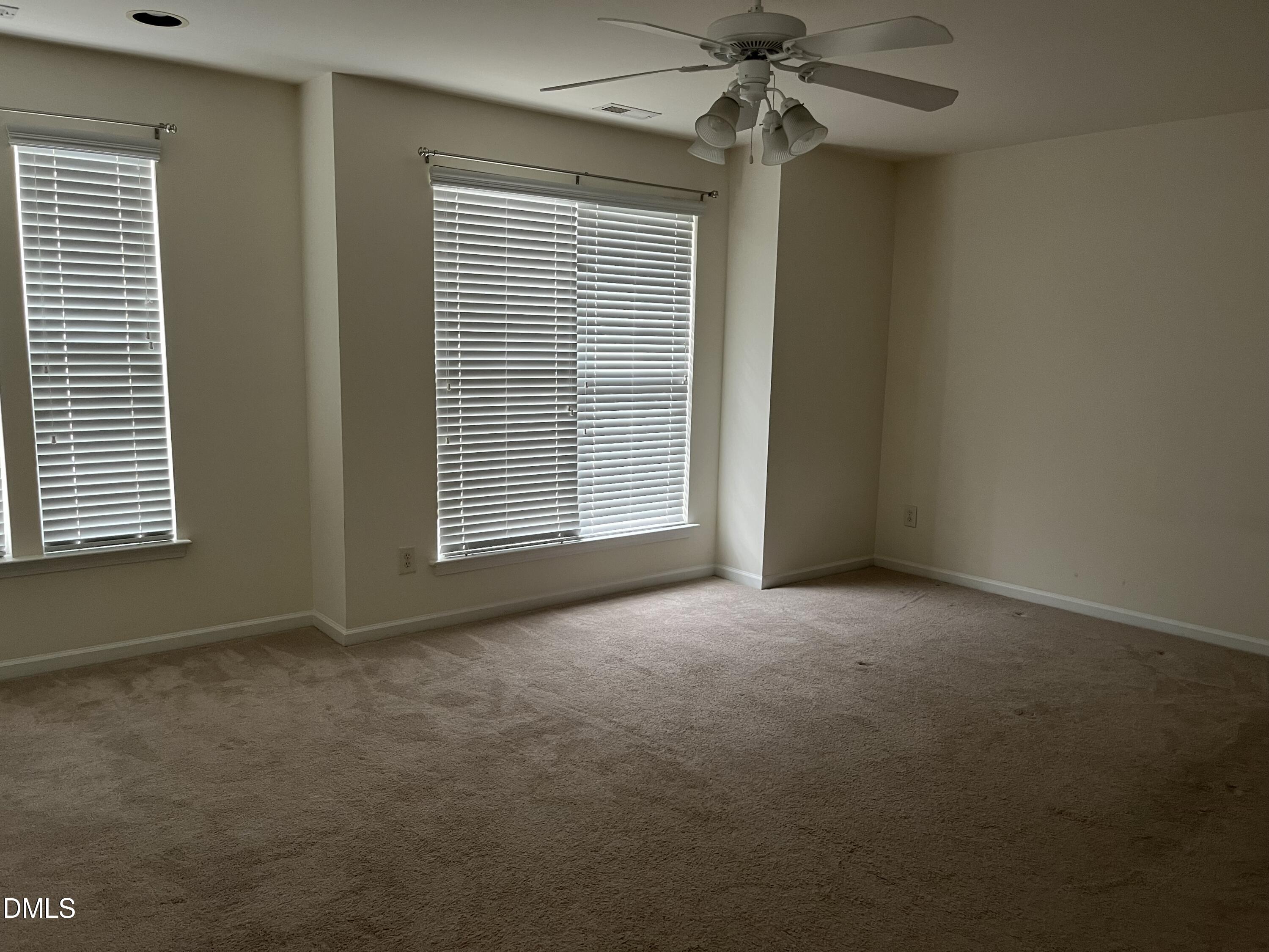 9827 Grettle Court Raleigh, NC 27617 - Photo 8 of 10 a view of an empty room with a window