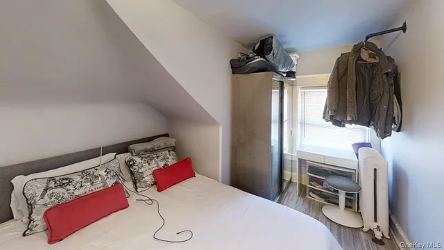 a bedroom with a bed and a closet