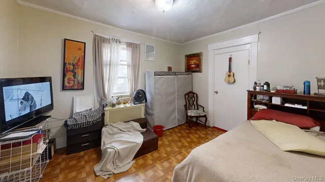 a bedroom with bed and a window